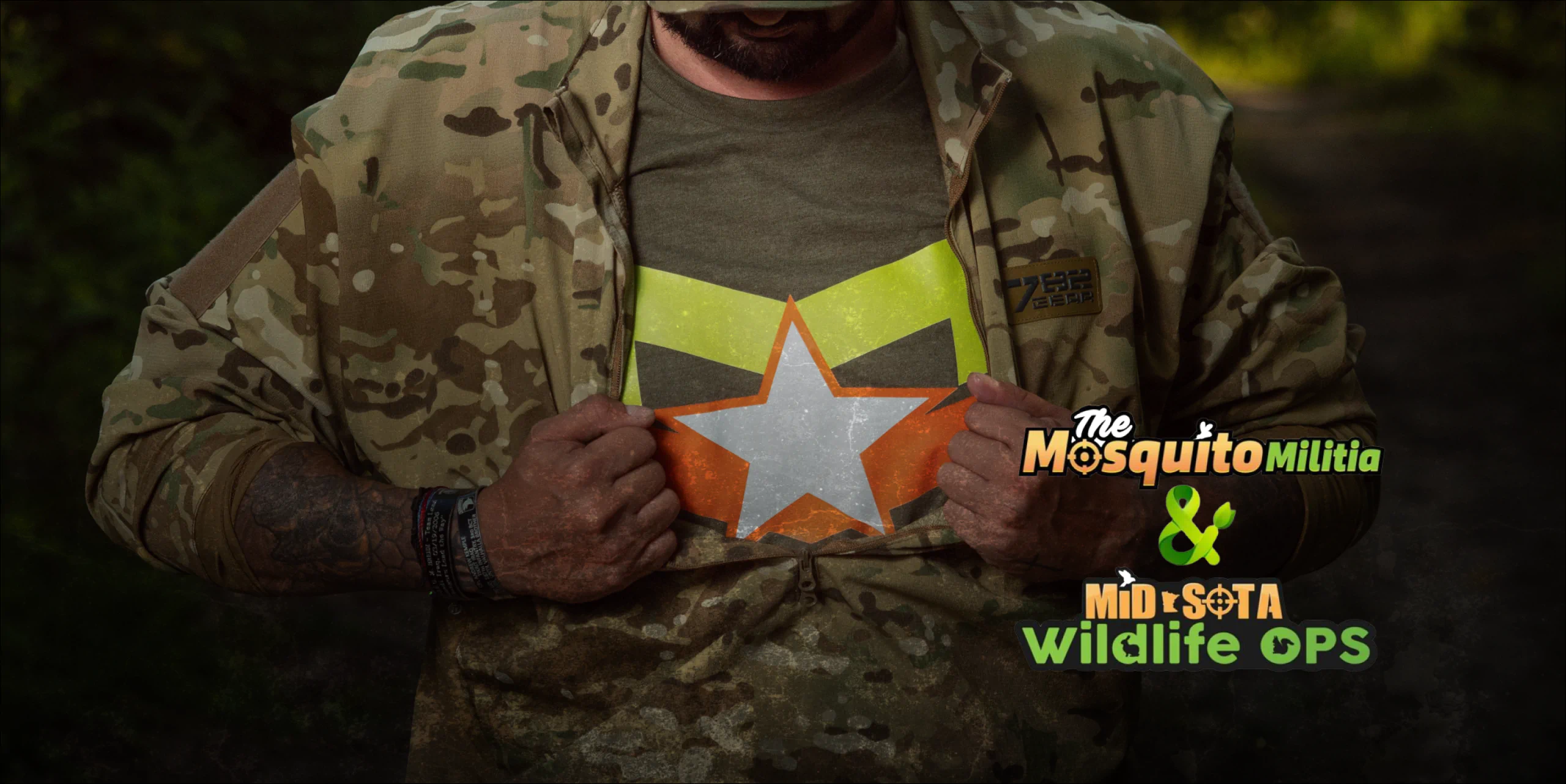 The Mosquito Militia & Mid Sota Wildlife Ops worker showing his shirt 2